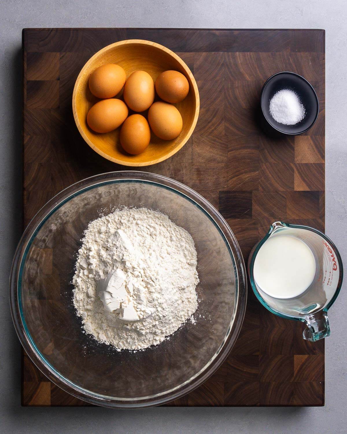 Ingredients shown: eggs, salt, flour, and milk.