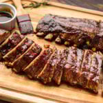 Tuscan ribs with balsamic glaze on cutting board.