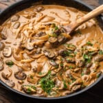 Chicken stroganoff in black pan.