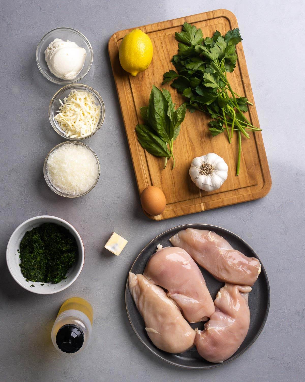 Ingredients shown: ricotta, mozzarella, parmesan, lemon, basil, parsley, garlic, spinach, olive oil, butter, and chicken breasts.
