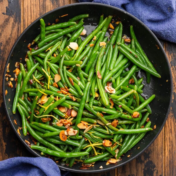 Black pan with green beans almondine.