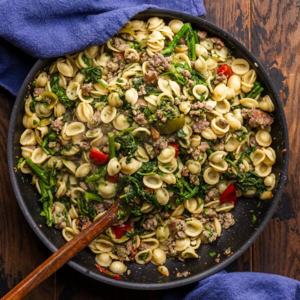 Large pan of orecchiette with sausage and broccoli rabe.