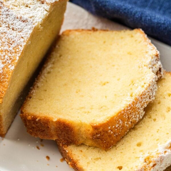 Slices of pound cake on white plate.