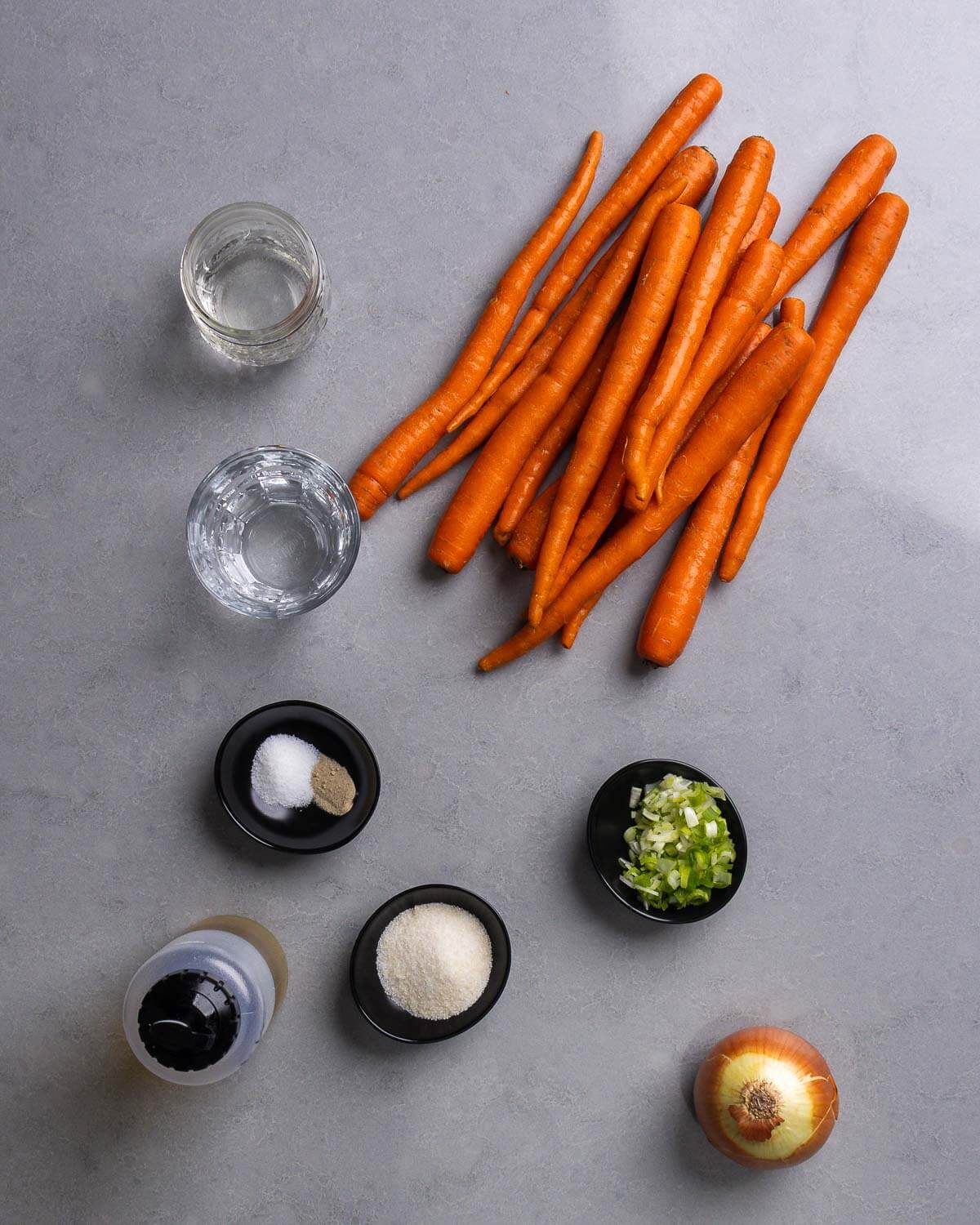 Ingredients shown: vinegar, water, carrots, salt, pepper, olive oil, sugar, green onions, and onion.