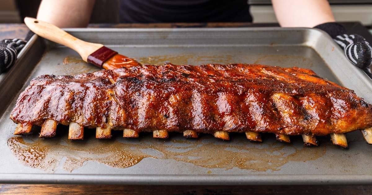 Oven Baked Ribs with Homemade BBQ Sauce - Sip and Feast