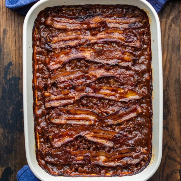 Baked beans in large baking dish.