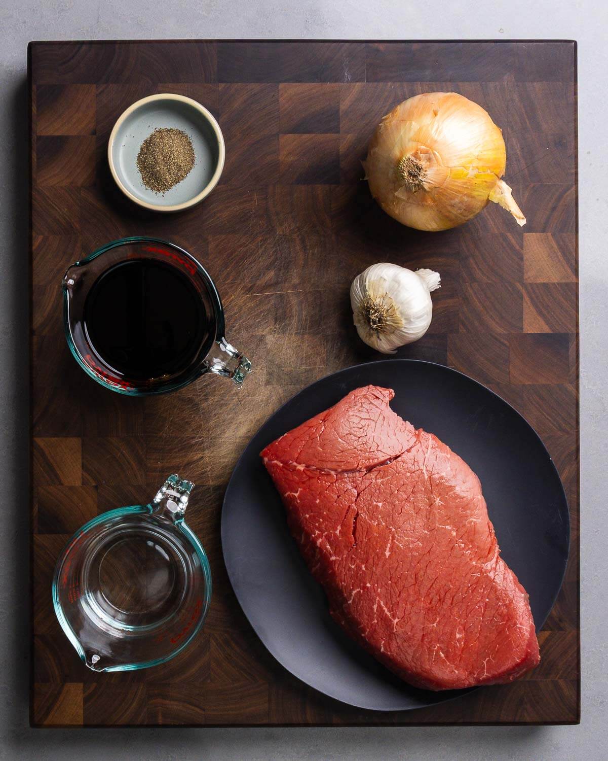 Ingredients shown: pepper, onion, garlic, light soy sauce, water, and London Broil.