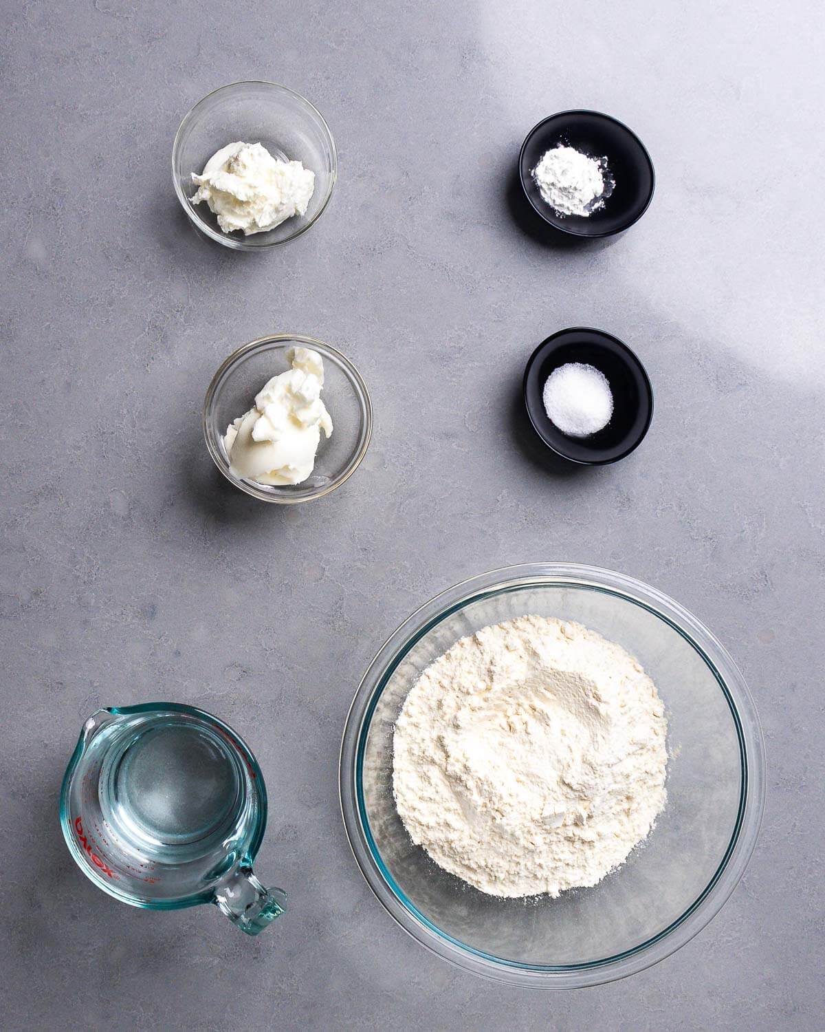 Ingredients shown: yogurt, baking powder, salt, lard, water, and flour.