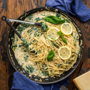 Lemon ricotta spinach pasta in large black pan.
