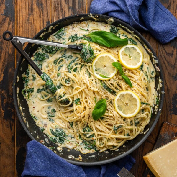 Lemon ricotta spinach pasta in large black pan.