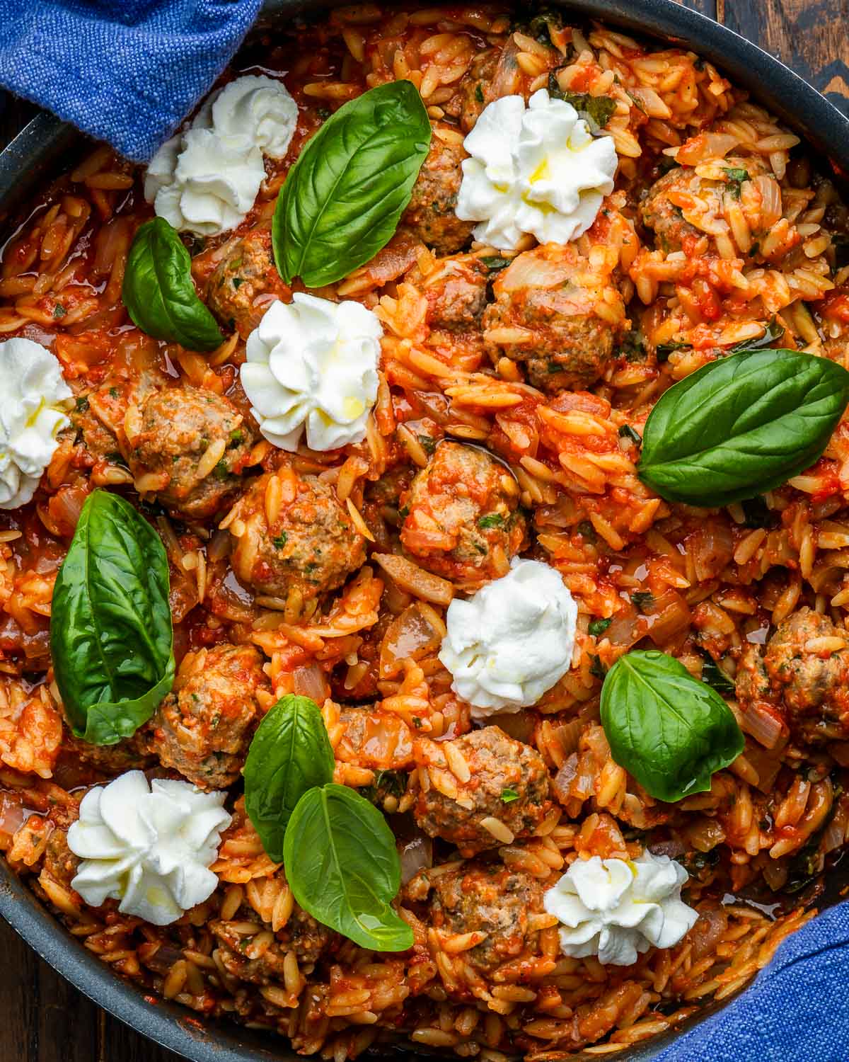 One-pot meatballs and orzo in large black pan.