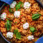 One-pot meatballs and orzo in large black pan.