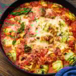 Zucchini rollatini in large black pan.