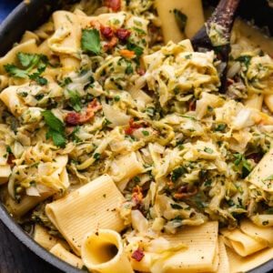 Cabbage bacon pasta in pan.