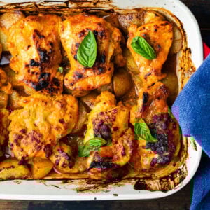 One-pan hot honey chicken and potatoes in baking dish.