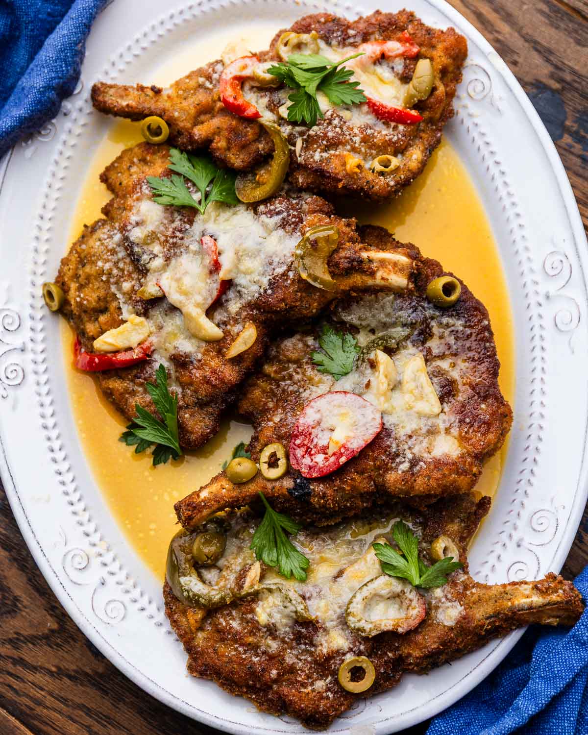 Pork chop martini on white platter.