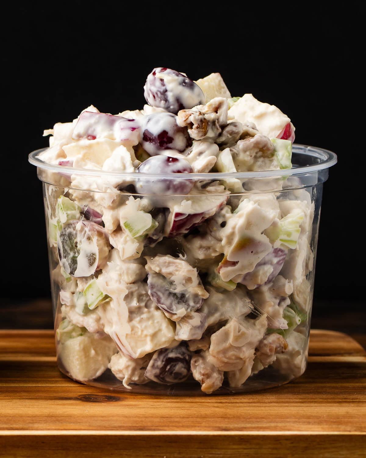 Waldorf chicken salad in deli container.