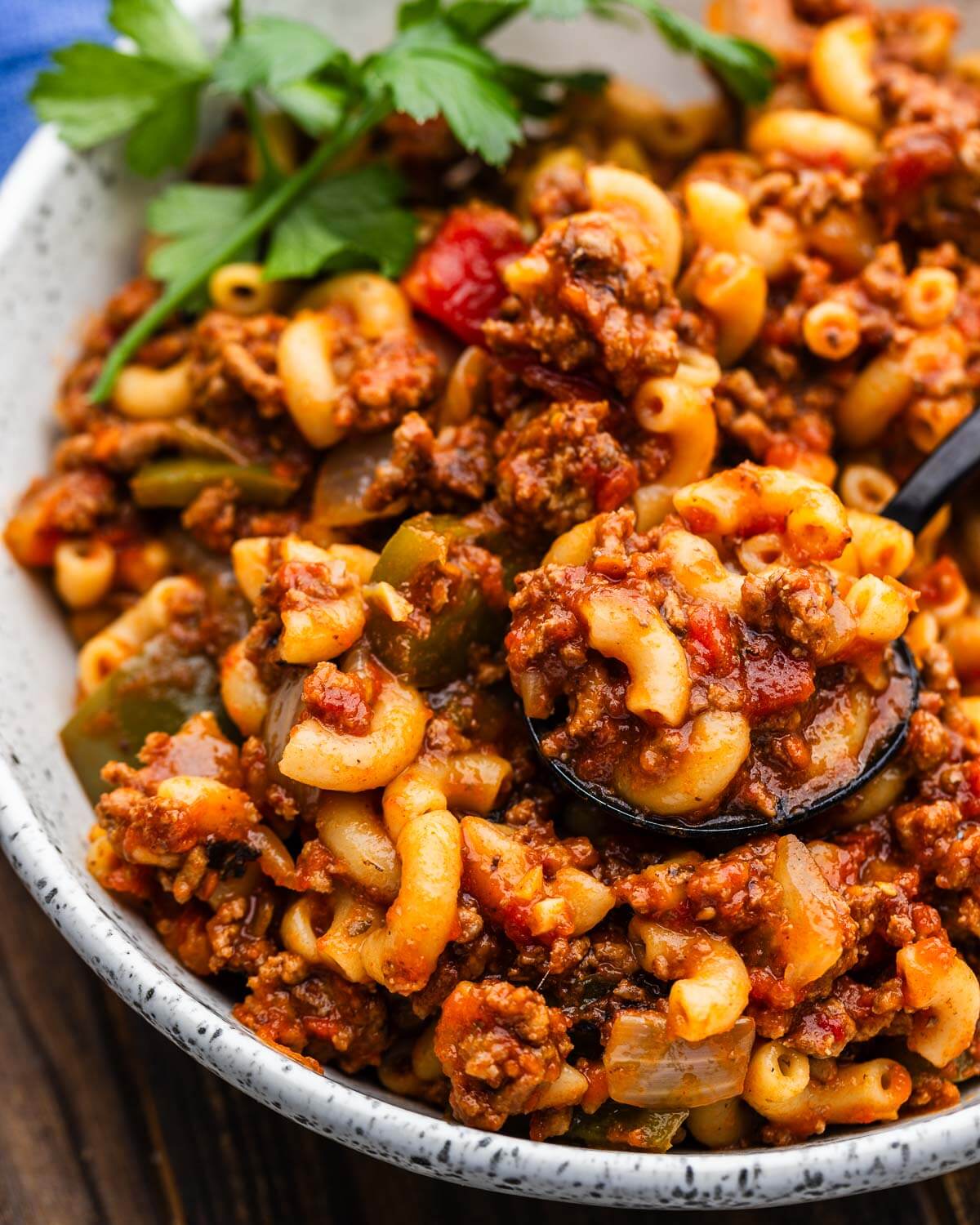 Bowl of American goulash (American chop suey) with spoon.