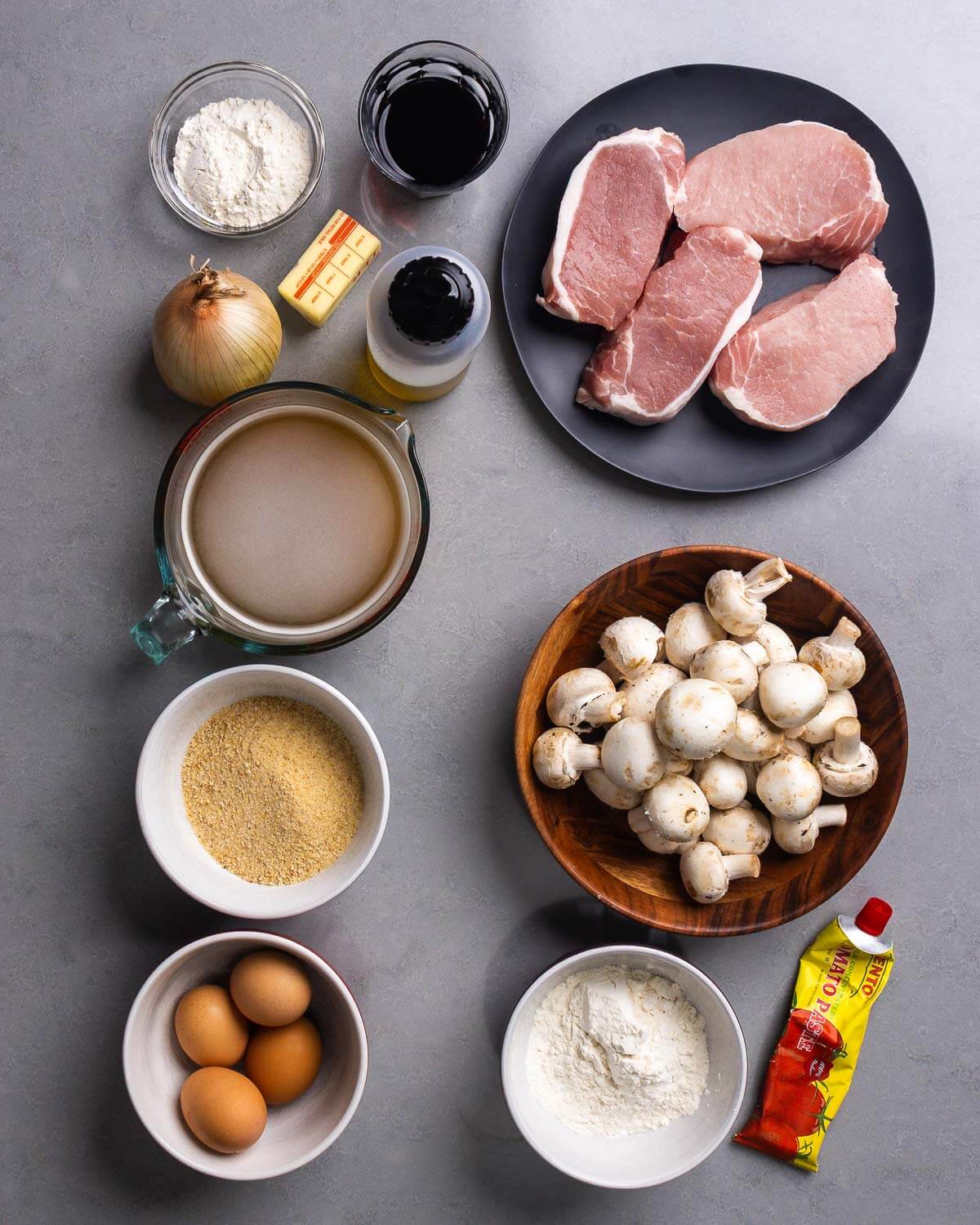 Recipe ingredients shown: flour, red wine, butter, onion, olive oil, pork chops, beef stock, breadcrumbs, eggs, mushrooms, and tomato paste.
