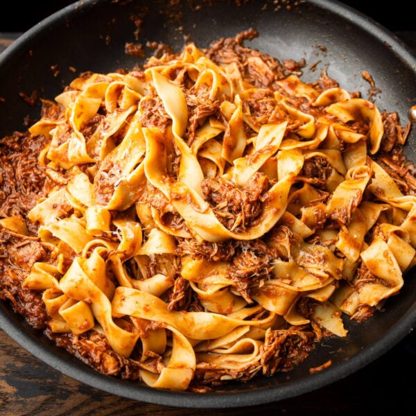 Black pan with pappardelle and Sicilian pork ragu.
