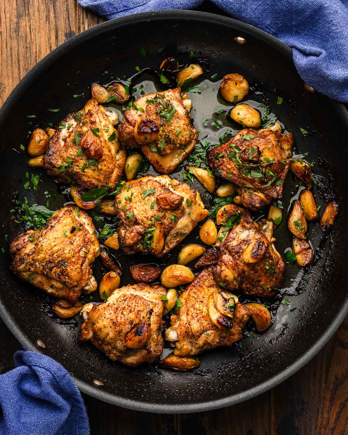 Large black with forty clove garlic chicken thighs.