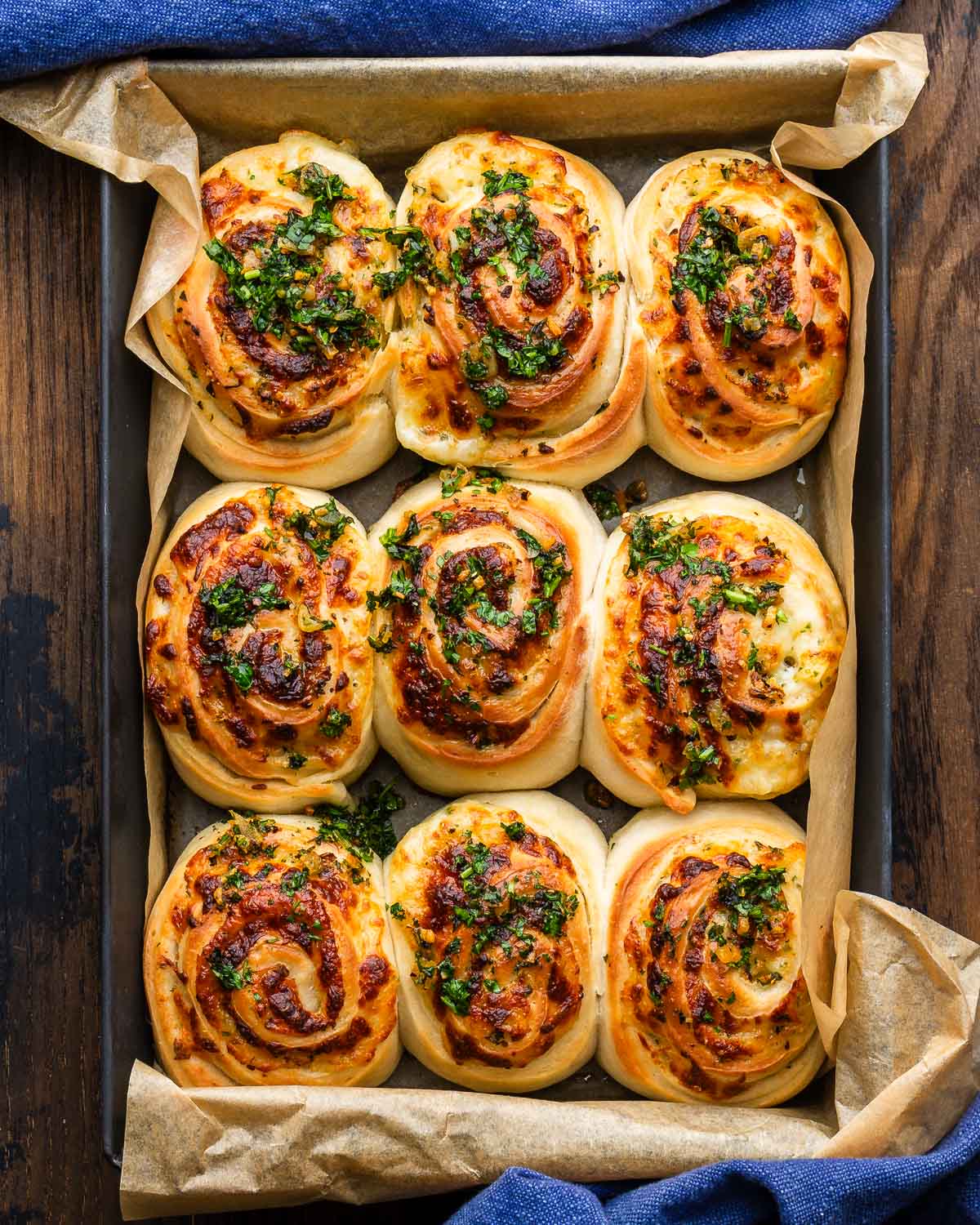 Large grey pan with cheesy garlic rolls.