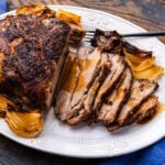 Large platter with sliced Italian roasted pork shoulder.