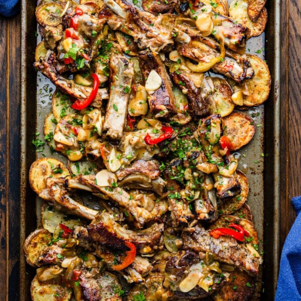 Sticky ribs with crispy potatoes in large sheet pan.