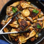 Chicken Provencal in large black pan.