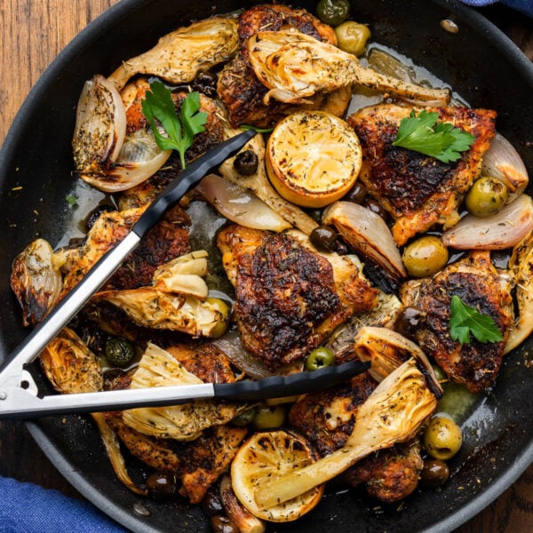 Chicken Provencal in large black pan.