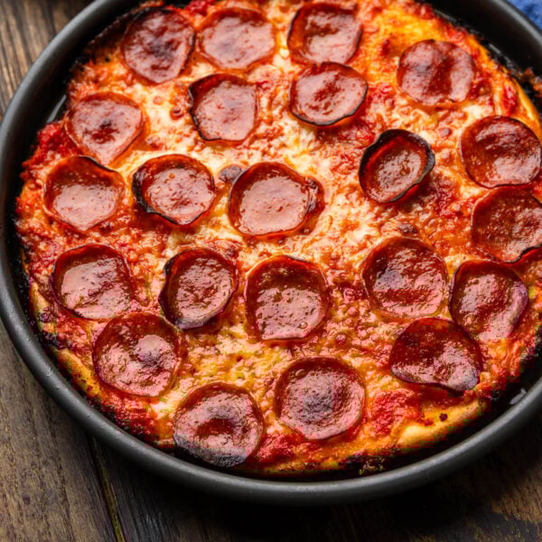 Bar pizza in on wooden table.