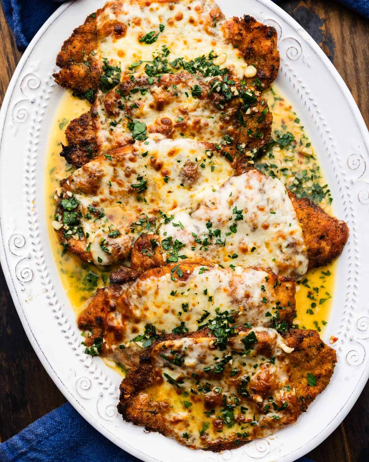 Chicken scampi in white platter.