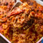 Spoon grabbing large section of anelletti al forno.