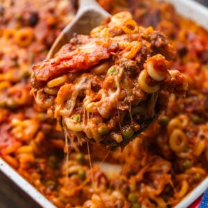 Spoon grabbing large section of anelletti al forno.