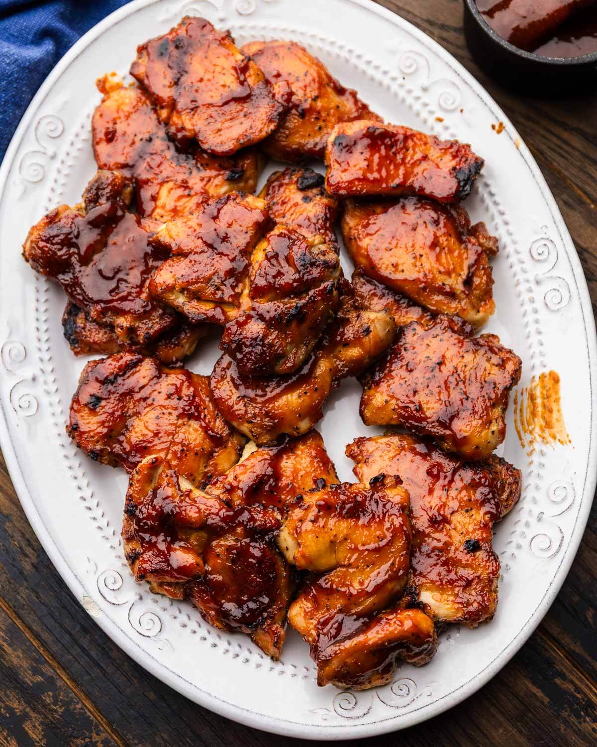 Platter with oven baked bbq chicken thighs.