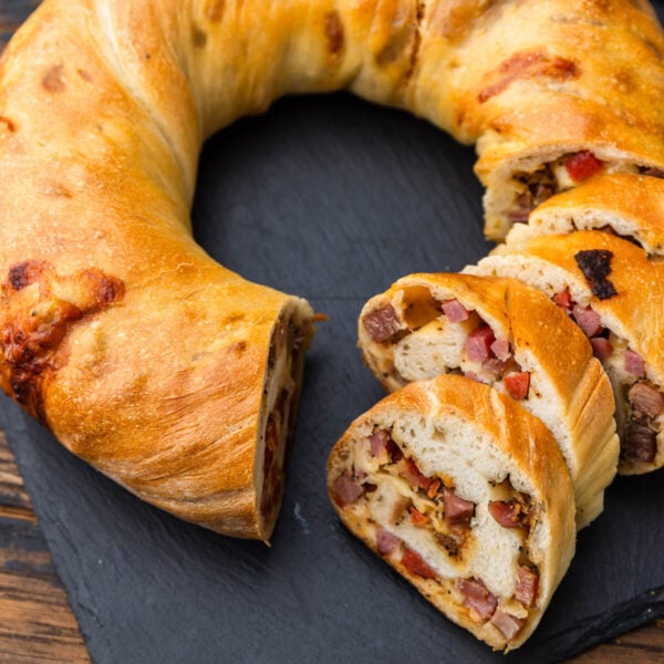 Baked prosciutto bread (lard bread) on slate serving plate.