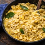 Creamy corn pasta in large pan.