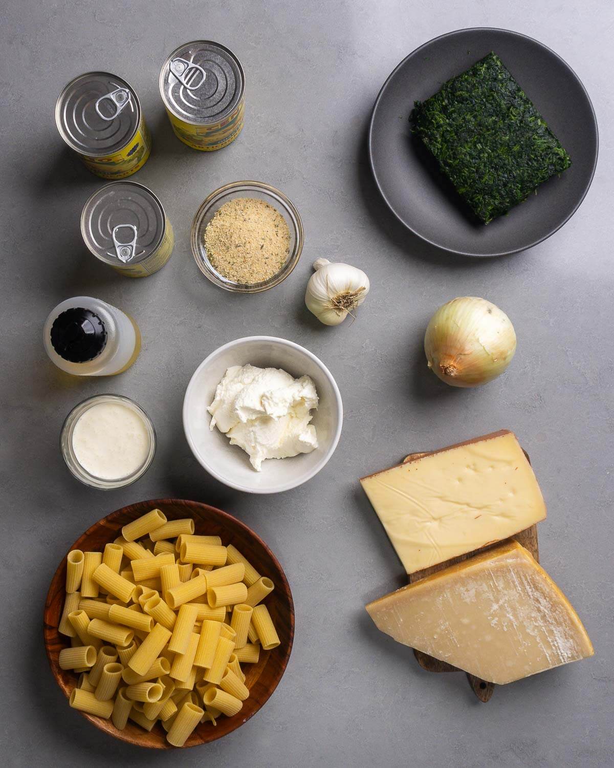 Ingredients shown: artichoke hearts, breadcrumbs, garlic, spinach, olive oil, heavy cream, ricotta, onion, rigatoni, fontina and parmesan cheese.