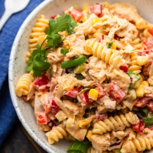 Barbecue chicken pasta salad in white bowl.