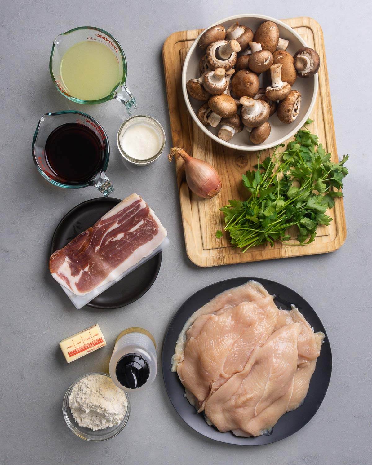 Ingredients shown: chicken stock, marsala wine, heavy cream, mushrooms, shallot, parsley, prosciutto, butter, olive oil, flour, and chicken cutlets.