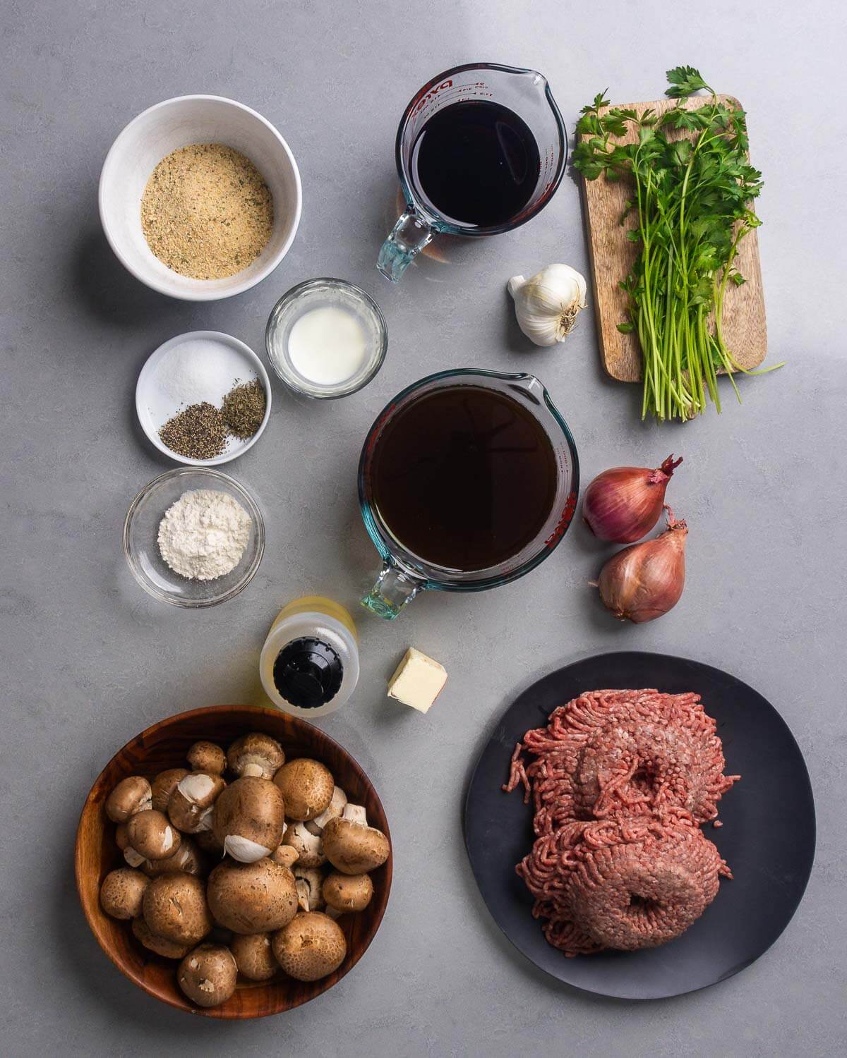Ingredients shown: breadcrumbs, salt, pepper, thyme, marsala wine, garlic, parsley, flour, olive oil, butter, beef stock, shallots, mushrooms, and ground chuck.