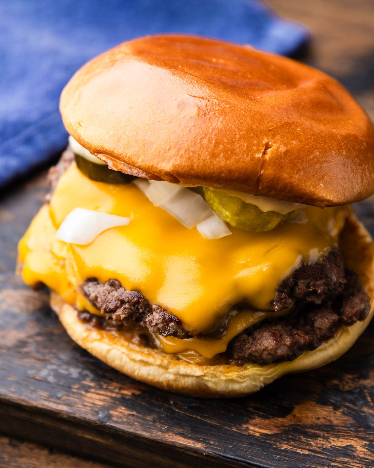 Smash burger on wooden board.