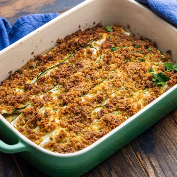 Zucchini potato al forno on wooden table.