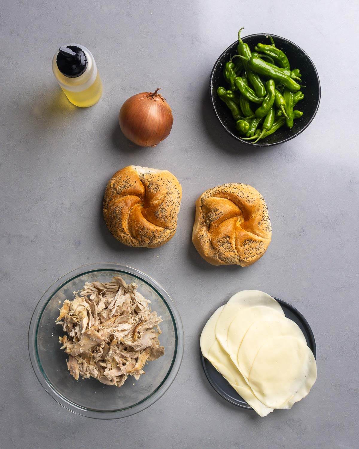 Ingredients shown: neutral oil, onion, shishito peppers, rolls, shredded rotisserie chicken, and provolone cheese.