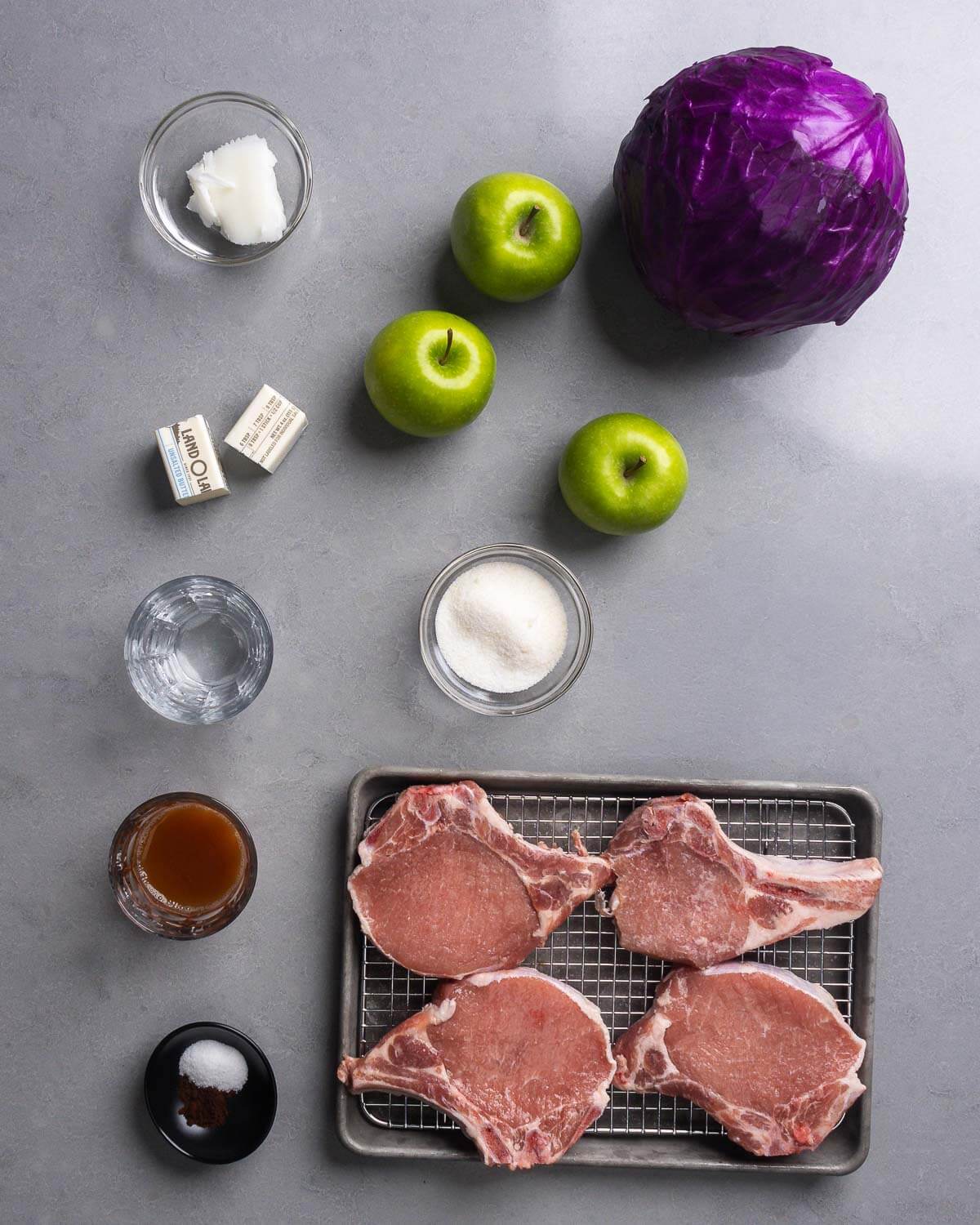 Ingredients shown: lard, apples, cabbage, butter, water, sugar, cider vinegar, salt, cloves, and pork chops.