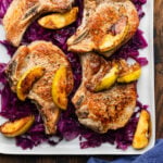Seared pork chops and apples over braised cabbage.