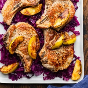Seared pork chops and apples over braised cabbage.
