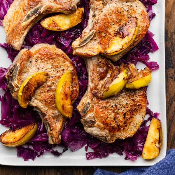 Seared pork chops and apples over braised cabbage.