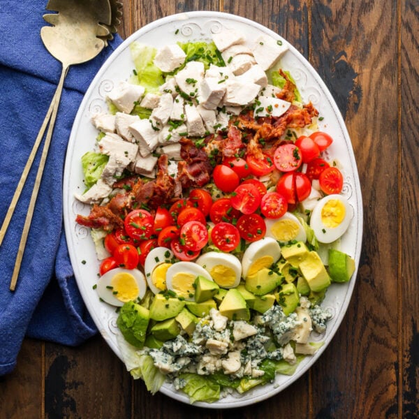 Cobb salad on white platter.