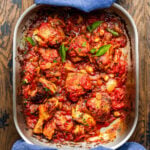 Metal roasting pan with pollo alla potentina.